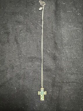 Silver Tone Cross Necklace with Green Gem Accents